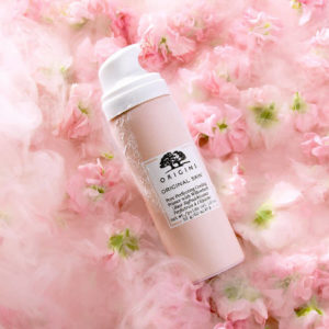 a cooling primer bottle a top light pink flowers