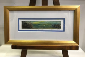 framed painting of ocean scene